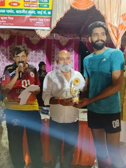 One of our senior players receiving an award at a tournament. Recognizing individual performance is part of celebrating the team's overall success.