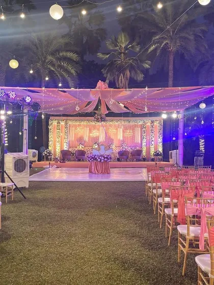 A full view of a reception setup, including the stage, guest seating, and lighting. This shows how all the elements come together to create a cohesive and beautiful event space.