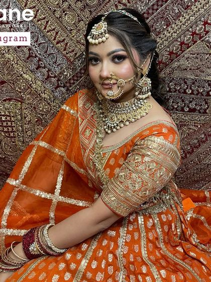 A final shot of the orange bridal look, capturing the complete ensemble. My goal is to train artists who can see and execute a total vision.