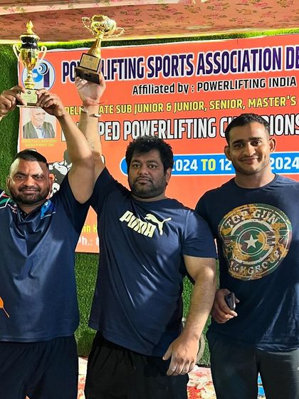 With my fellow lifters, holding the gold medal and Strongman title at the Delhi state equipped powerlifting championship.