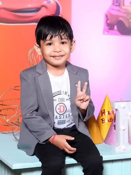 A playful 'Mickey Mouse' themed birthday party, with bright colors, character cutouts, and a fun balloon arch, creating a joyful atmosphere for little ones.