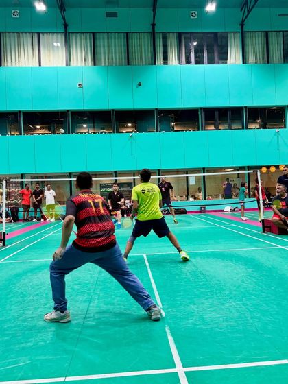 An action shot from the Ninja Dojo Duel, capturing the intensity of a doubles match.