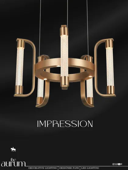 The 'Impression' chandelier is a modern classic, combining a brushed gold frame with textured crystal cylinders. I recommend this fixture for dining rooms or boardrooms where you want to make a statement of confident luxury.
