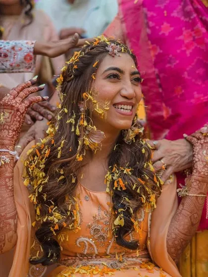Haldi and mehendi, a perfect combination. A candid moment of pure joy as my bride Akshata is showered with flower petals during her haldi ceremony.