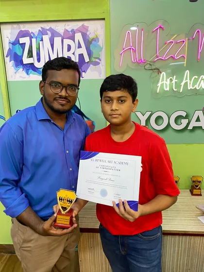 A participant from our Rapid Chess Tournament receiving his certificate of participation and a trophy from the instructor.