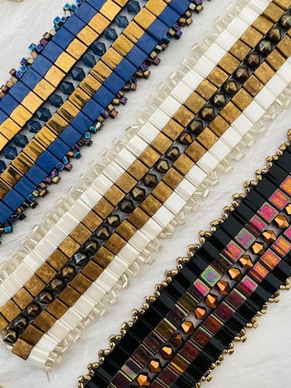 A trio of beautifully crafted beaded bracelets in different colour combinations, showing the variety within a single brand.