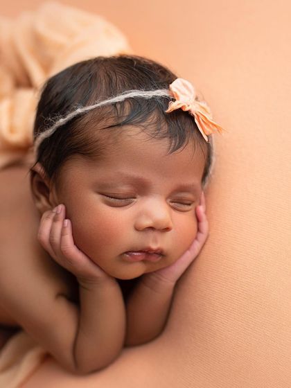 The classic "froggy" pose, with baby's head resting on their hands. This is a composite image, always done safely, to create this incredibly cute portrait.