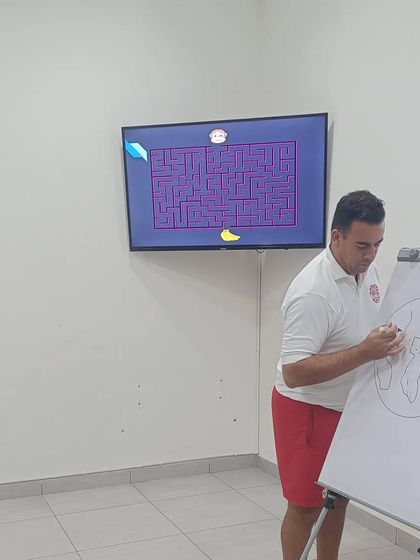 Our performance coach uses a whiteboard and interactive games to teach mental skills, making learning engaging and effective.