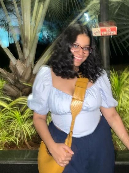 The Selena in a warm tan croc print, worn as a comfortable crossbody. The wide strap makes it perfect for all-day wear.