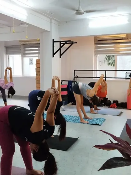 A deep forward fold, Prasarita Padottanasana, helps to release tension in the back and hamstrings while calming the mind.