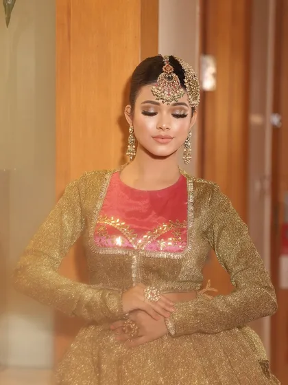 Eyes closed to show the soft, natural-looking foundation and eyeshadow.