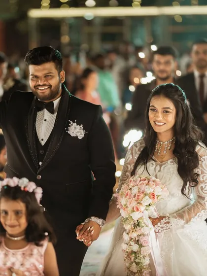 The grand entrance of the bride and groom at their reception.
