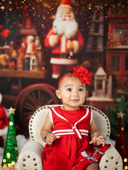 A beautiful, sparkling Christmas portrait. The bokeh lights in the background add a touch of magic to the scene.
