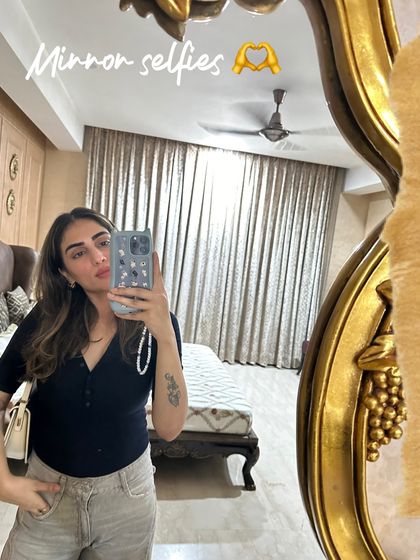 Another mirror selfie, this time with a black henley top and light-colored jeans. A simple and comfortable everyday look.