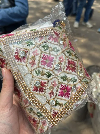 Another stunning clutch with floral embroidery and rhinestone details. Each one is handmade and has a unique charm.