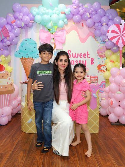Another happy family enjoying the sweet celebration. Our party setups provide a fantastic backdrop for capturing memories with all your loved ones.