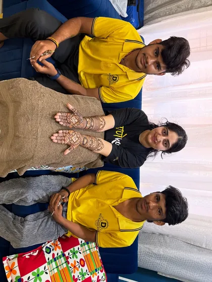 A happy client after her engagement mehndi session with two of our senior artists. We ensure a professional and comfortable experience.