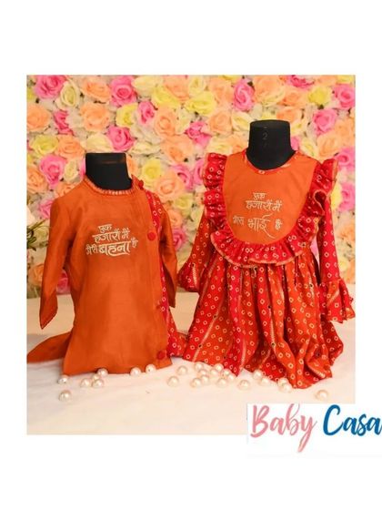 Celebrate the bond of siblings with our custom ethnic wear. This set features a 'Phoolon ka taaron ka' theme, with an orange kurta for the brother and a matching dress for the sister.