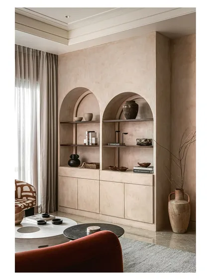 A slightly different angle of the arched shelving unit, highlighting its depth and the way it plays with light and shadow. This is an example of how I use architectural details to add character to a room.