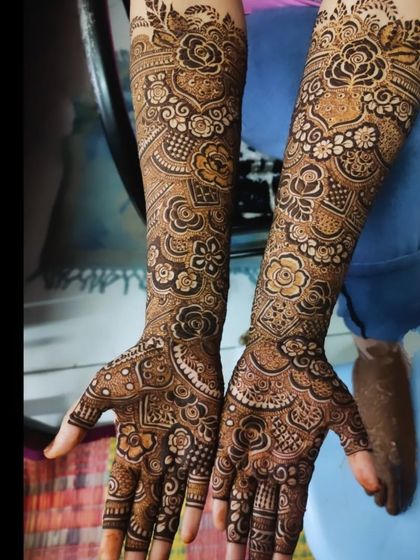 A full arm design showcasing a variety of techniques, including shaded roses, fine lines, and bold patterns.