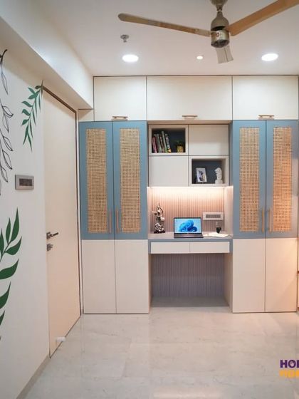 A wider view of the bedroom, showing how we integrated a study unit, a bed with storage, and a pooja niche all within a single wall of custom furniture.