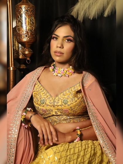 Another angle of the colorful Haldi look. The floral jewelry completes the vibe.