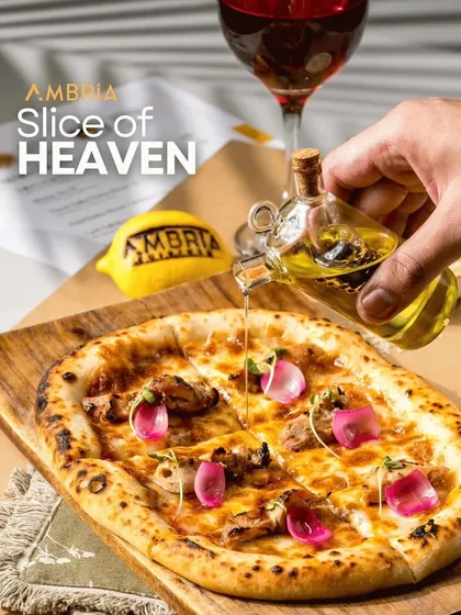 A "Slice of Heaven." Our wood-fired pizza drizzled with infused olive oil, topped with pickled onions and chicken. A gourmet pizza experience for your guests.