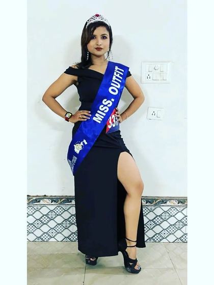 Posing with my "Miss. Outfit" sash and crown. Competing in fitness and bodybuilding events is a great way to challenge myself and stay motivated.
