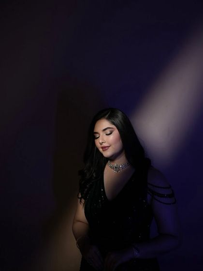 I love playing with light and shadow to create dramatic, artistic portraits for my clients once their look is complete.