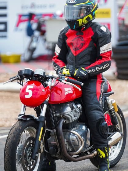 A student sitting on his bike, ready for his session. The number on his bike coincidentally matches his birthday.