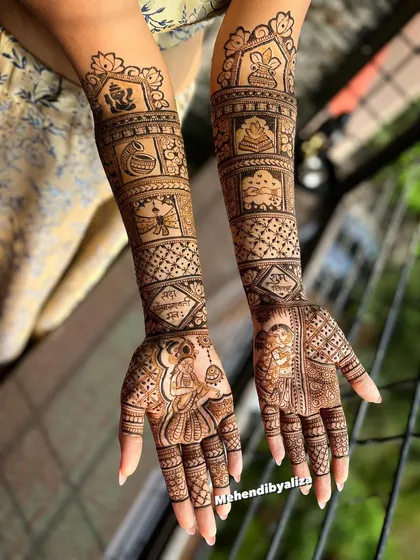 A masterpiece for a beautiful bride. This full bridal mehendi is a classic example of traditional design, filled with intricate patterns, portraits, and auspicious symbols like the kalash and Ganesha for a blessed beginning.