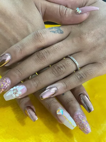 A glamorous set featuring rose gold chrome, pink glitter, and a stunning 3D flower with crystal accents.