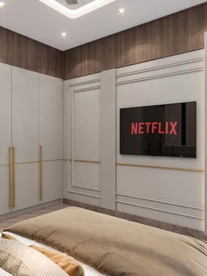 The TV unit wall in the parent's room features a blend of classic molding and modern design. The clean lines of the wardrobe and gold handles enhance the overall luxurious feel of the room.