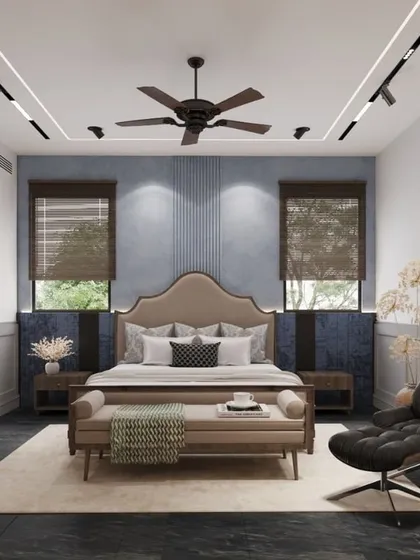 This bedroom design is inspired by minimal, tasteful, and classical aesthetics. We used a soothing blue and grey color palette, wainscoting on the walls, and curated artwork to create a calm, sophisticated, and timeless interior for this Noida residence.