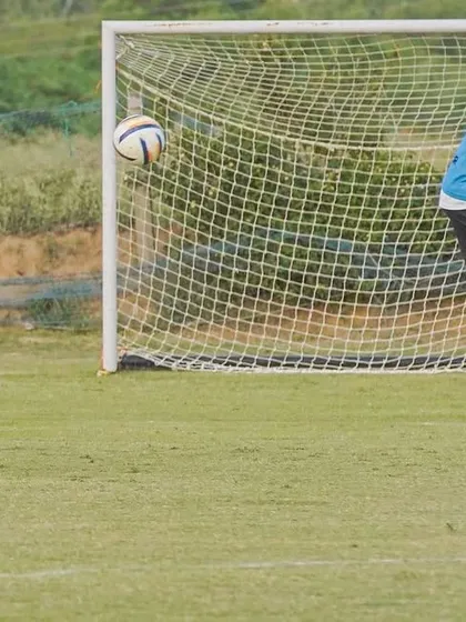 A player lining up for a free-kick. A great opportunity to score.