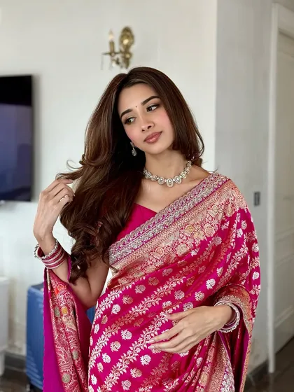 A confident pose showing off the full look. The makeup is fresh and radiant, perfect for a daytime engagement ceremony.