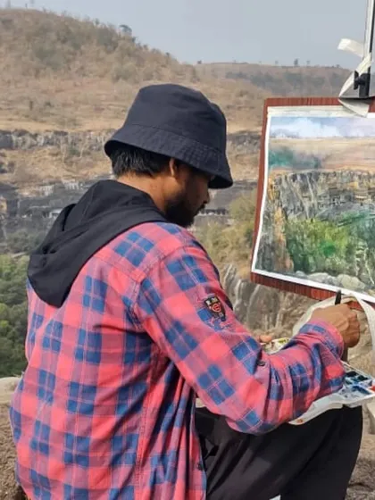 Here I am working on a watercolor painting on location at the Ajanta cave viewpoint in Maharashtra. Connecting with historical landscapes is vital to my process, as it allows me to draw inspiration directly from the deep artistic and cultural roots of our land.
