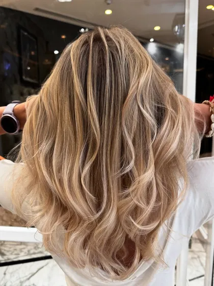 Another angle of the platinum blond blend, capturing the hair's healthy shine and beautiful cool tones.