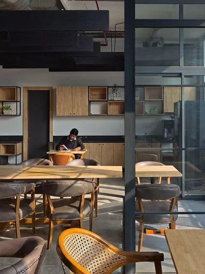 A quiet corner in the Visage office provides a space for focused work or relaxation. The design again emphasizes the connection to the outdoors, with large windows and a simple, clean material palette.