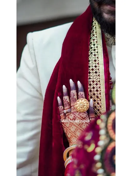 A candid shot from a wedding, showing the beautiful dark stain of the bride's henna. It's a testament to the quality of natural henna and good aftercare.