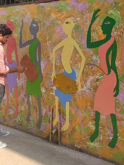 The process of adding color to the large folk art wall mural, bringing the figures of the musicians to life.