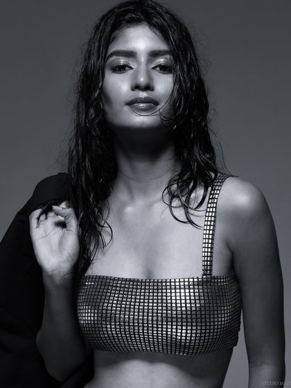 A black and white portrait from the "wet look" series, with a cool and confident pose.