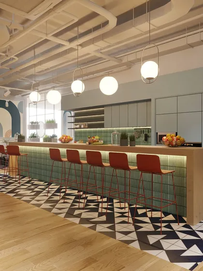 The pantry and bar area, with its sleek counter, vibrant green tiles, and bold red bar stools. This space is designed to be both a functional kitchen and a lively social hub for the community.