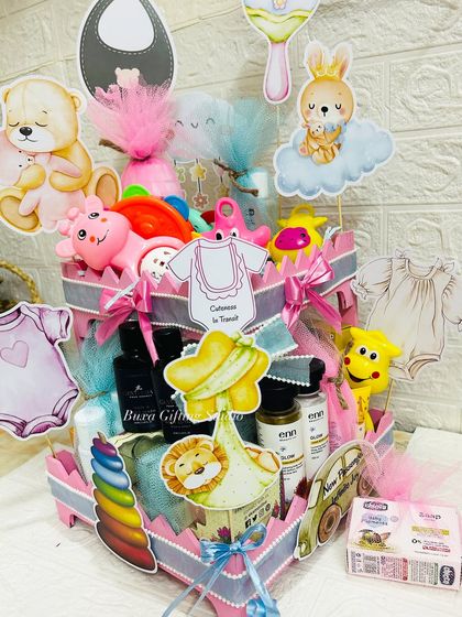 The fully assembled heart-shaped baby shower hamper, a perfect centerpiece gift for the parents-to-be.