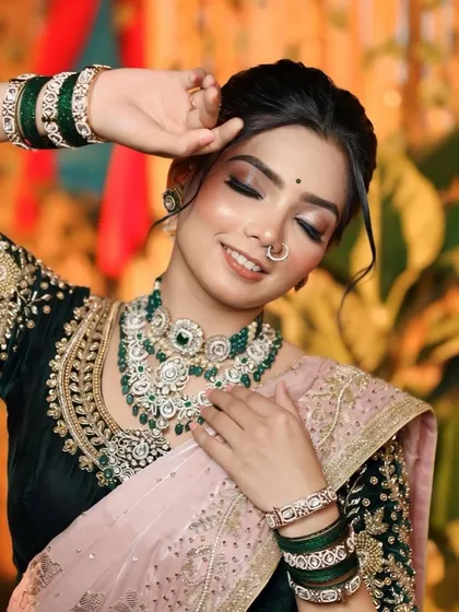 A beautiful candid shot showing the detailed eye makeup. The soft brown and shimmer tones make her eyes pop without looking heavy.