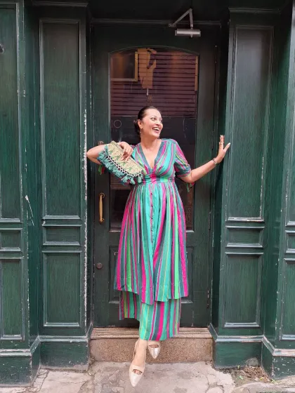 A vibrant striped co-ord set that’s full of personality. The combination of the dress and matching trousers is a unique take on modern ethnic wear, perfect for making a statement.