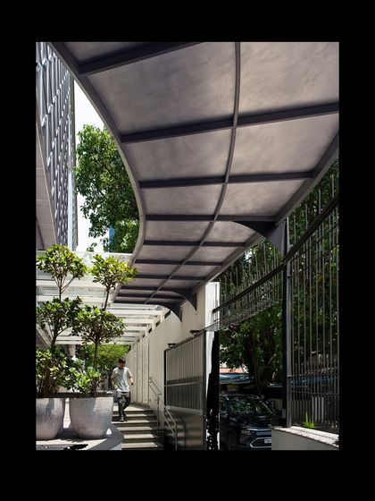 The curved canopy at the entrance of MAP provides shelter and guides visitors into the museum. Its form is both functional and sculptural, creating a welcoming transition from the street.