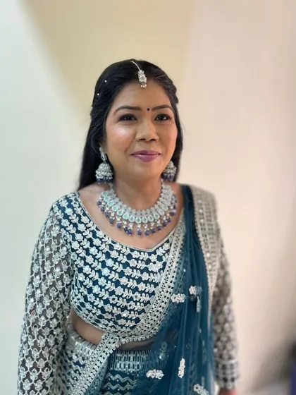 This client chose a beautiful teal blue lehenga with silver sequin work. A unique and stunning color for an evening event.