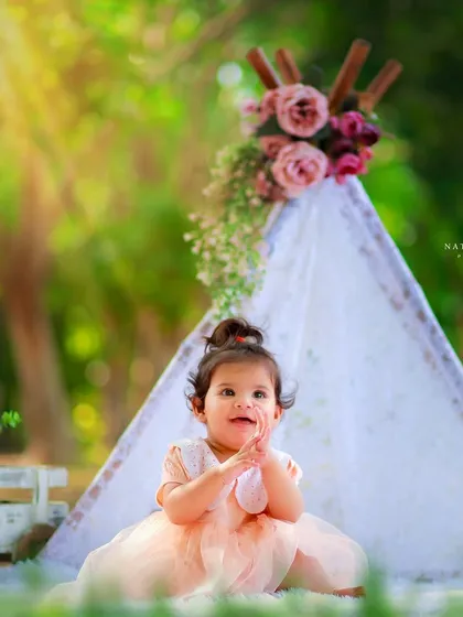 We love creating dreamy setups for your little ones. This outdoor portrait uses a beautiful lace teepee and soft sunlight to create a magical, storybook feel for a baby girl's photoshoot.