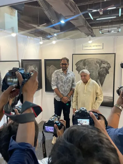 Posing for the press with Javed Akhtar saab in front of my elephant artwork. It was a memorable day with significant media attention.